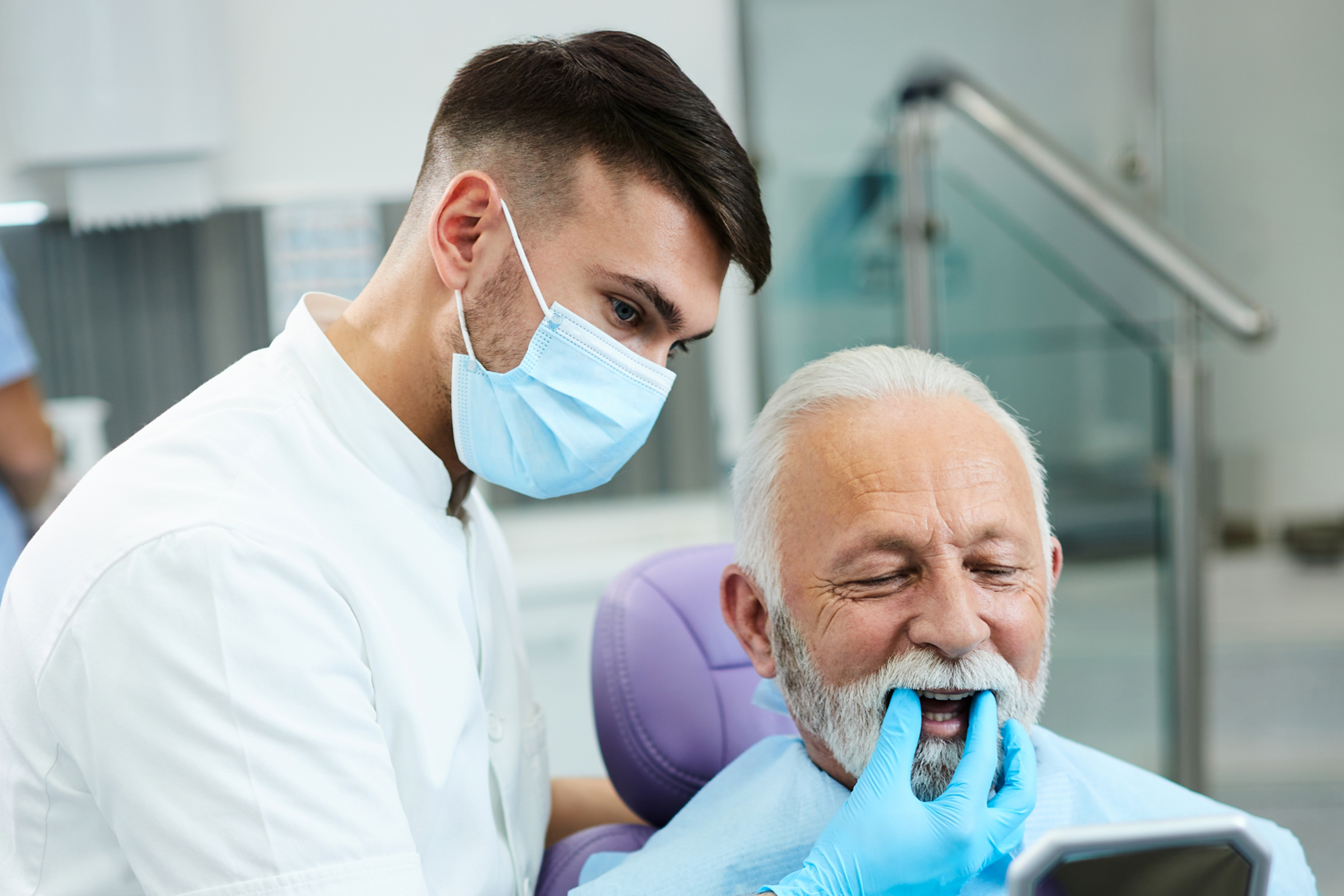Dentist examining patient